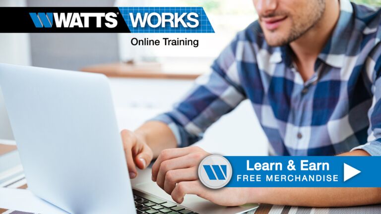 Man sitting at a desk working on a computer